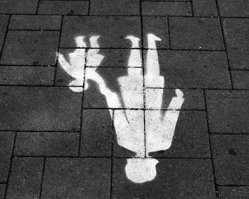 High angle view of arrow symbol on road
