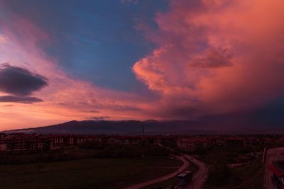 Panoramic view of city against sky at sunset