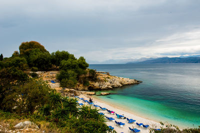 High angle view of swimming pool by sea against sky