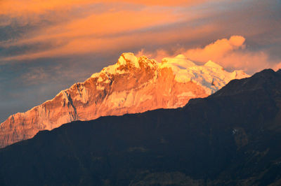 Scenic view of mountains against sky during sunset