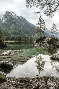 Scenic view of lake and mountains against sky