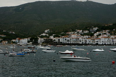 Scenic view of town by sea