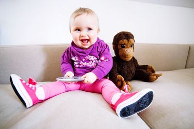 Portrait of smiling baby playing  at home