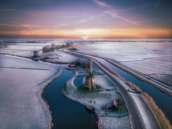 High angle view of illuminated bridge against sky during sunset