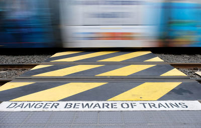 Blurred motion of train at railroad station platform