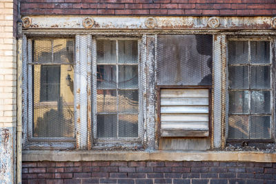 Close-up of window of abandoned building