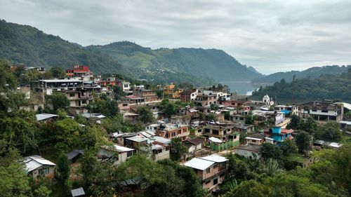 Houses in town against sky