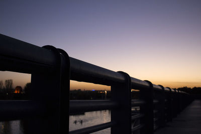 View of bridge in city against clear sky