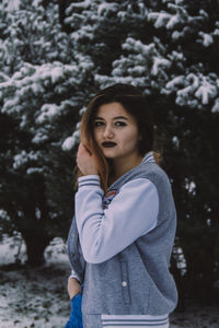 Portrait of a beautiful young woman in winter