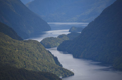 High angle view of bay against mountains