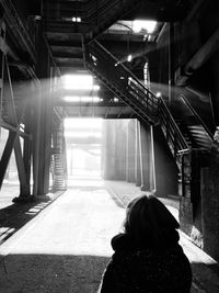 Rear view of woman in abandoned building