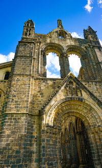 Low angle view of historical building against sky