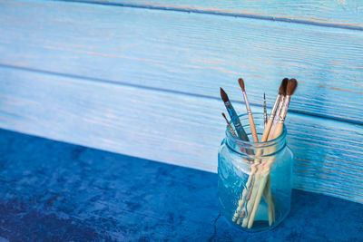 High angle view of glass jar on table