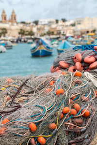 Close-up of fishing net in harbor