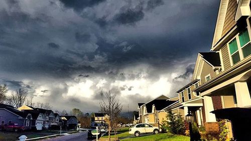 City street against cloudy sky