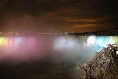 Panoramic view of lake against sky at night