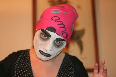 Close-up portrait of mature woman with face paint during halloween 