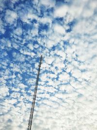 Low angle view of communications tower against sky