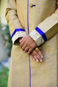 Midsection of man wearing kurta