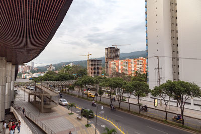 Road in city against sky