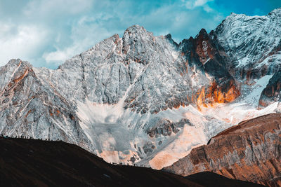 Crowd of people standing against mountain