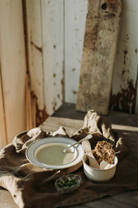 Plate with soup in rustic setting