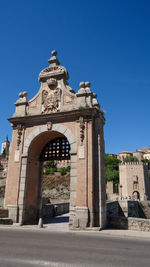 View of historic building against clear blue sky