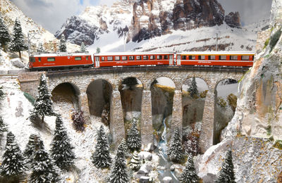 View of train passing through snow covered bridge