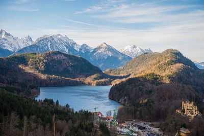 Scenic view of lake amidst mountains against sky