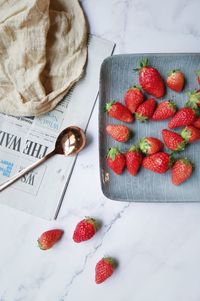 High angle view of strawberries on table