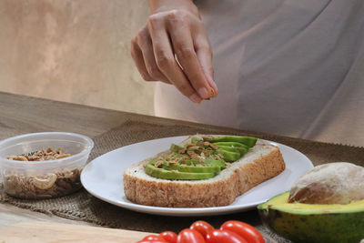 Midsection of man preparing food