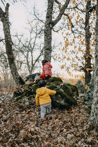 Brother and sister exploring the forest