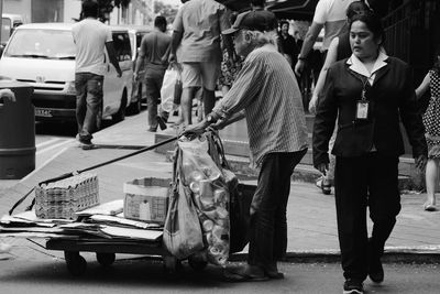 People on road in city