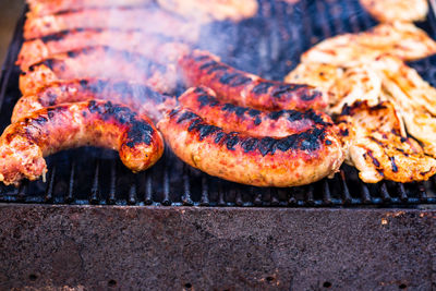 High angle view of meat on barbecue grill