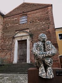 Low angle view of sculpture on building