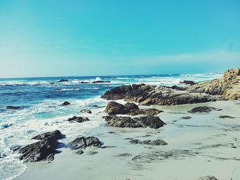 Scenic view of sea against clear blue sky
