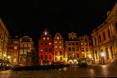 Illuminated buildings in city at night