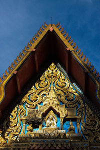 Low angle view of ornate building against sky