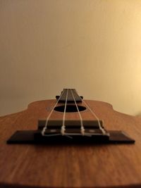 Close-up of guitar on table