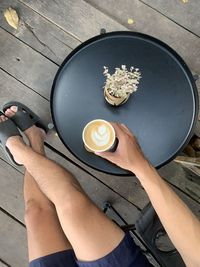 High angle view of woman holding drink