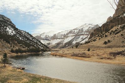 Scenic view of landscape and mountains against sky