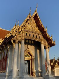 Low angle view of temple against building