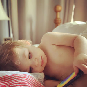 High angle view of cute baby girl reading 