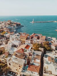 Drone picture from the sky of beautiful old town, the sea and venetian old port of chania in crete