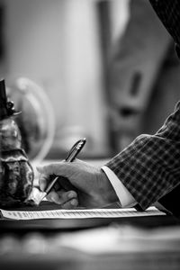 Close-up of woman hand on table