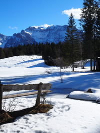Scenic view of snow covered mountains against sky