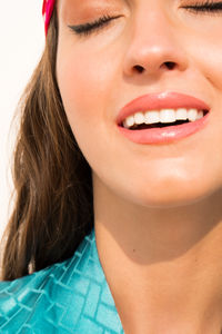 Close-up portrait of a smiling young woman with a beautiful white  teeth