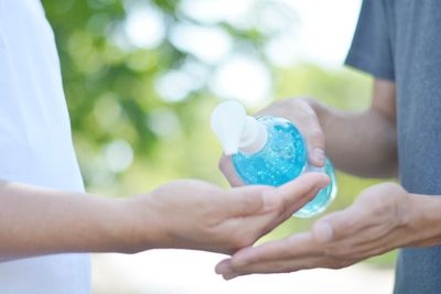 Cropped image of man holding hands