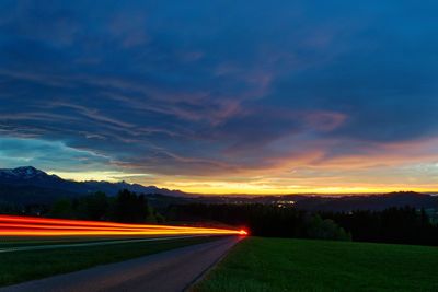 Scenic view of road against sky during sunset