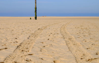 Scenic view of beach against clear sky